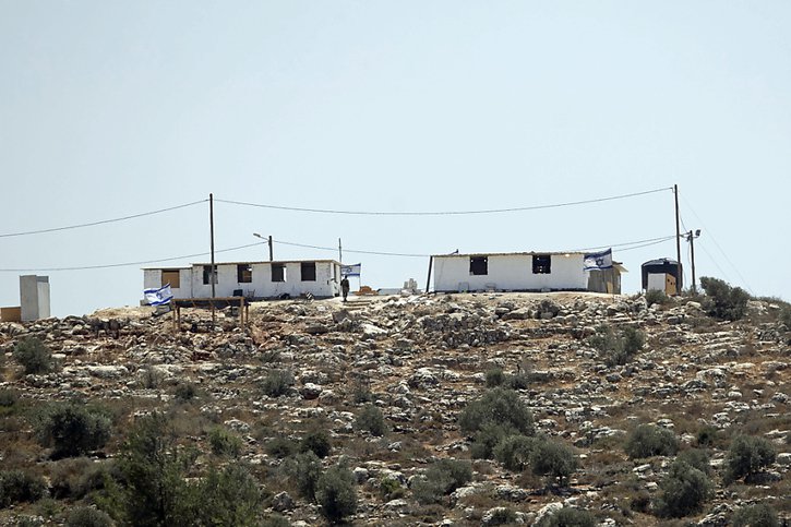 Des colons israéliens se sont installés au début mai sur une colline près du village de Beita afin de fonder la colonie d'Eviatar, sans obtenir l'autorisation du gouvernement israélien. © KEYSTONE/AP/MAJDI MOHAMMED